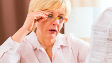 Woman reading drug insert