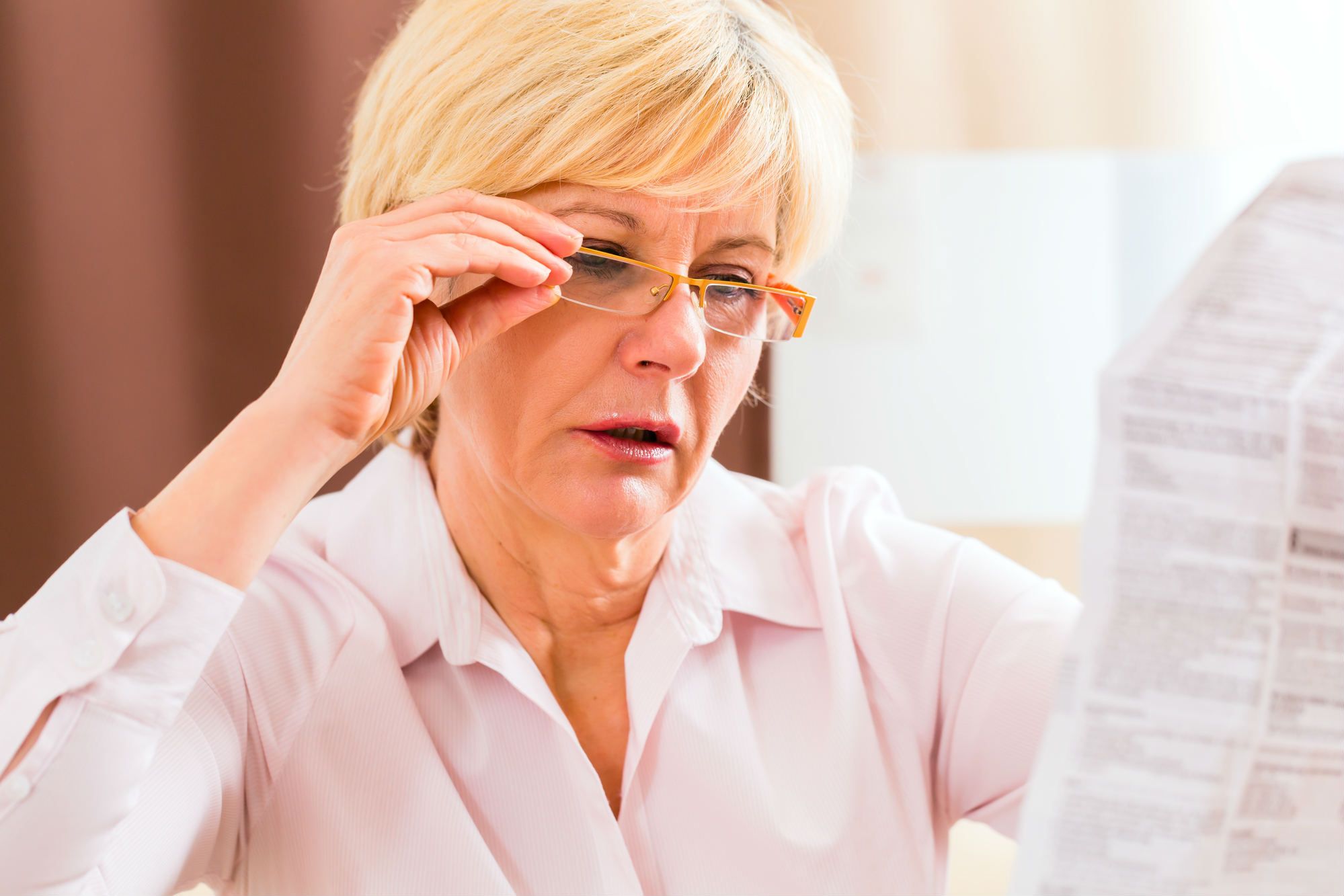 Woman reading drug insert