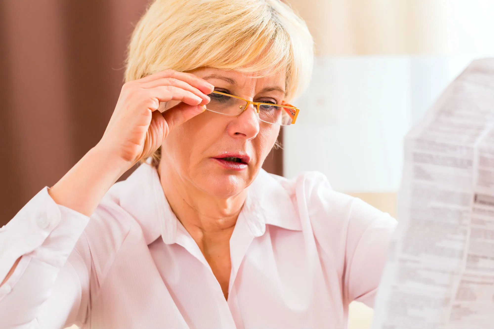 Woman reading drug insert