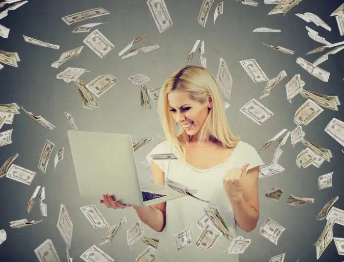 woman using Top Class Actions to claim settlement money