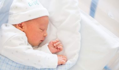 baby sleeping in an inclined sleeper
