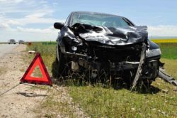 Car wrecked on the side of the road