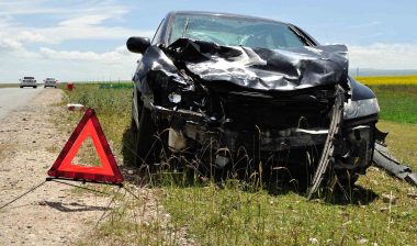 Car wrecked on the side of the road