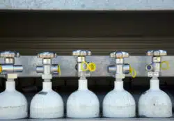 Five compressed gas cannisters