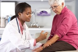 Elderly woman getting an injection