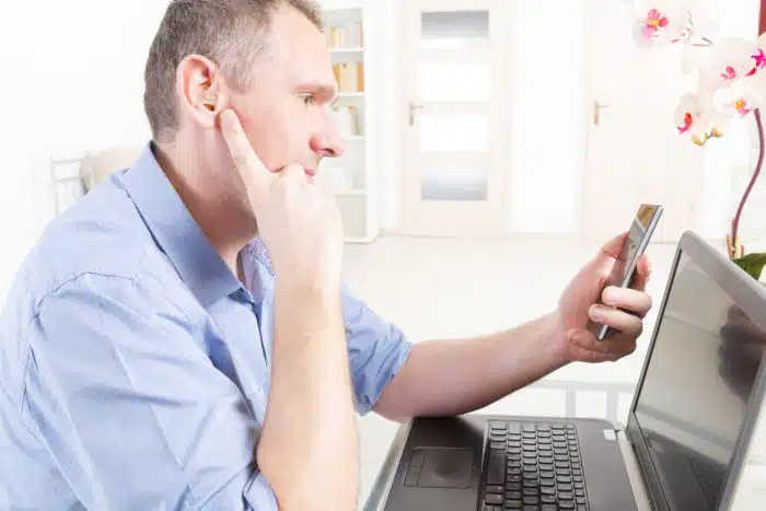 hearing impaired man watching pornhub on laptop