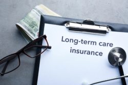 long term disability insurance application and stethoscope