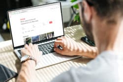 man using AirBnB website regarding double ticketing lawsuit
