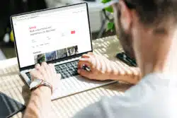 man using AirBnB website regarding double ticketing lawsuit