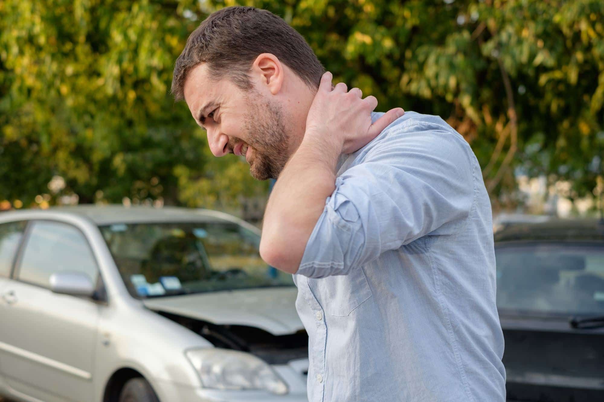man with whiplash pain