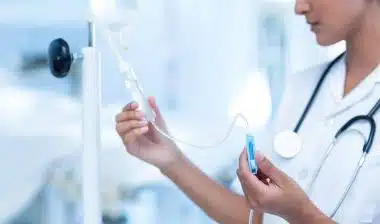 nurse setting up MRI contrast IV