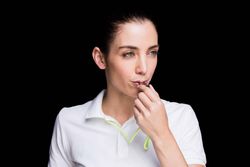 Woman blowing whistle