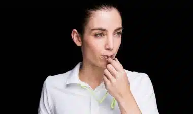 Woman blowing whistle