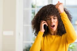 Angry woman yells on the phone
