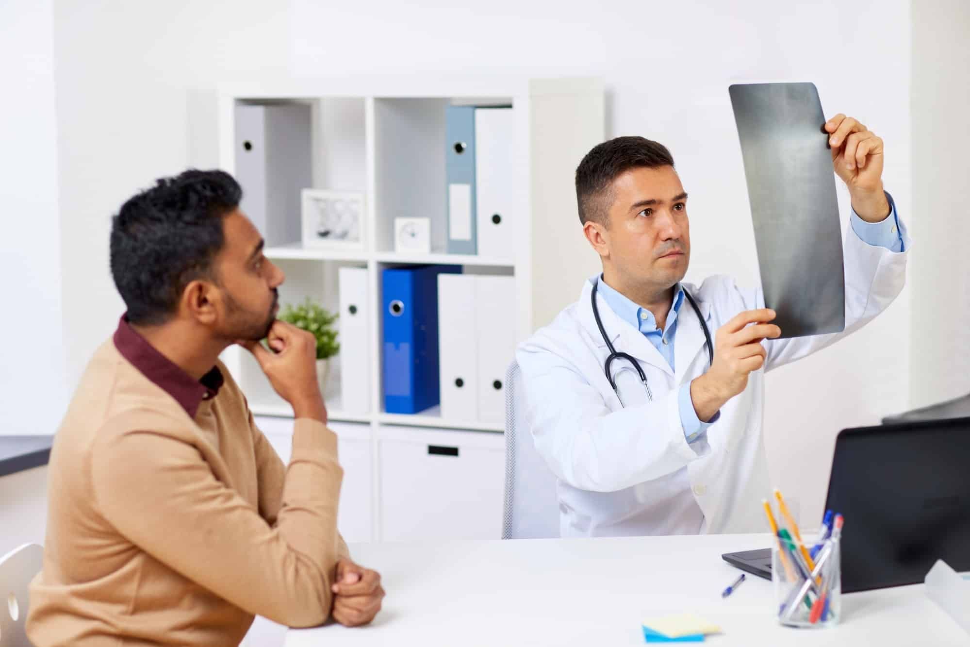 doctor and patient looking at chest xray