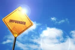 Impounded vehicle sign