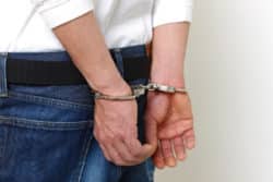 man in handcuffs regarding the man arrested by RCMP while likely having a stroke