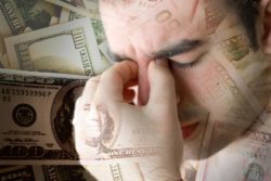 man stressed over money