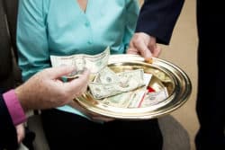 money in church collection plate regarding the Nova Scotia class action against charity gospel for Asia accusing them of fraud
