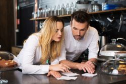 restaurant assistant manager working with wait staff