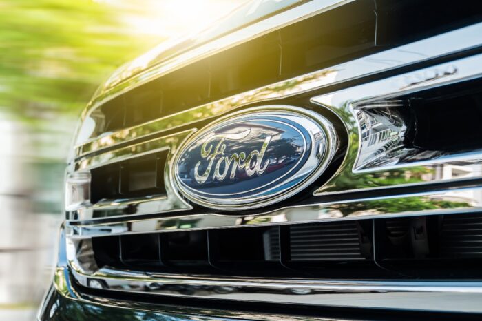 close up of Ford logo on grill of truck