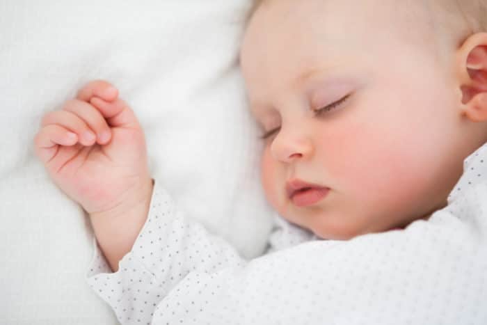 baby sleeping in Kolcraft inclined sleeper