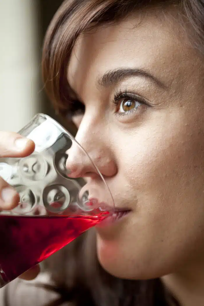 woman drinking ocean spray cranberry juice