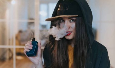 Young person vaping JUUL e-cigarette