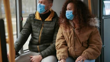 couple wearing masks due to the coronavirus outbreak