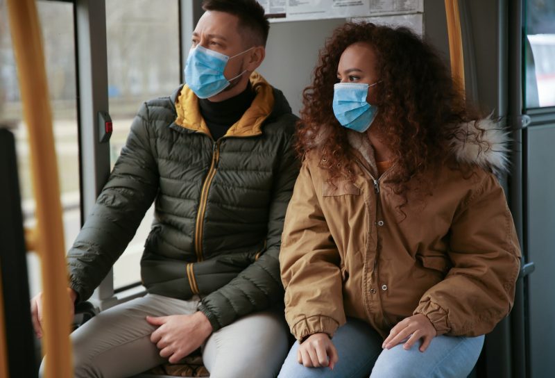 couple wearing masks due to the coronavirus outbreak