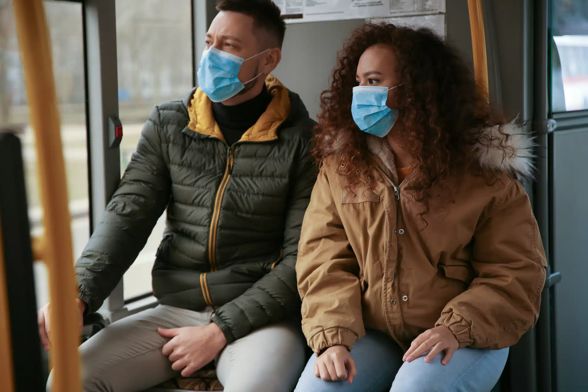 couple wearing masks due to the coronavirus outbreak