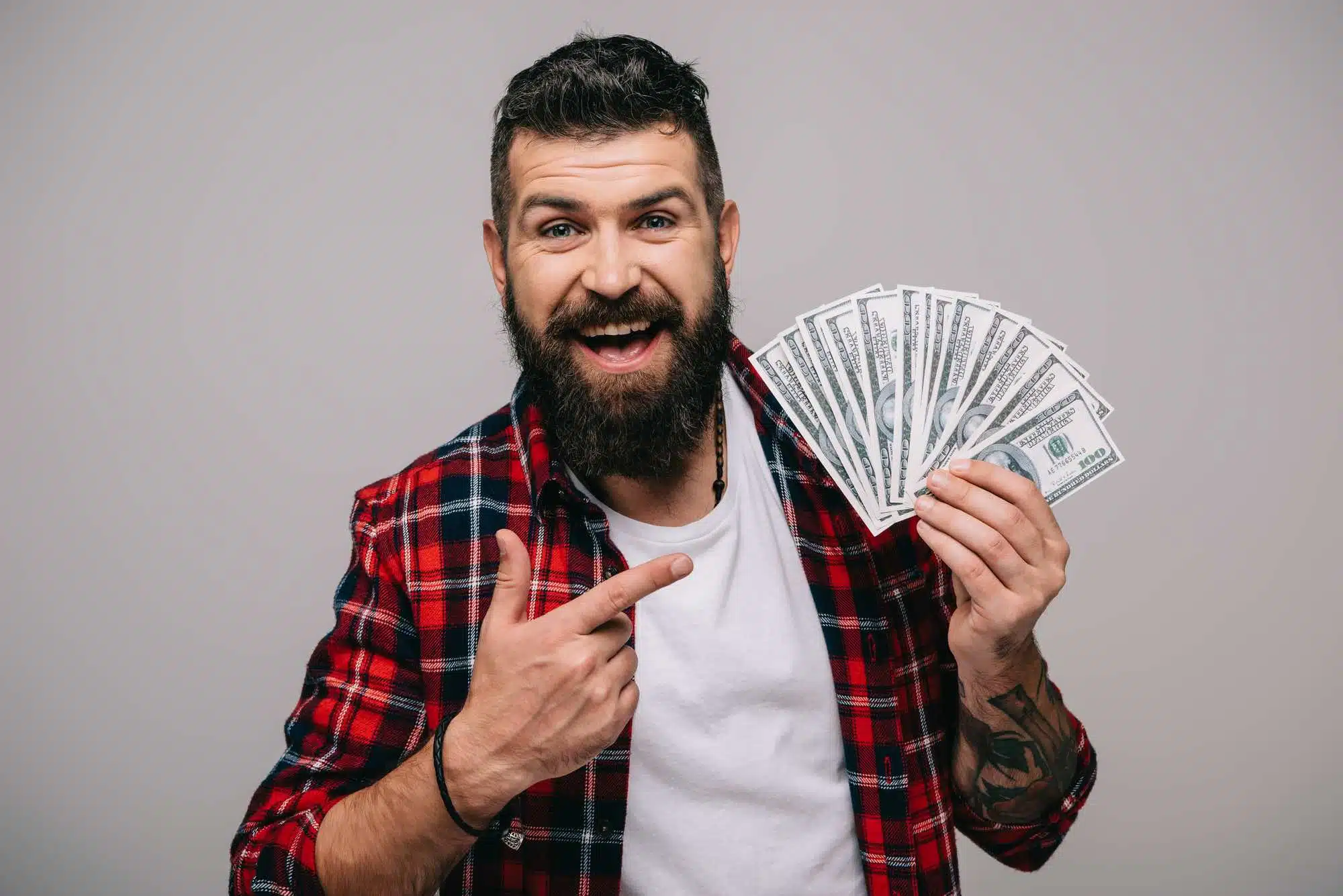 Happy man holding cash