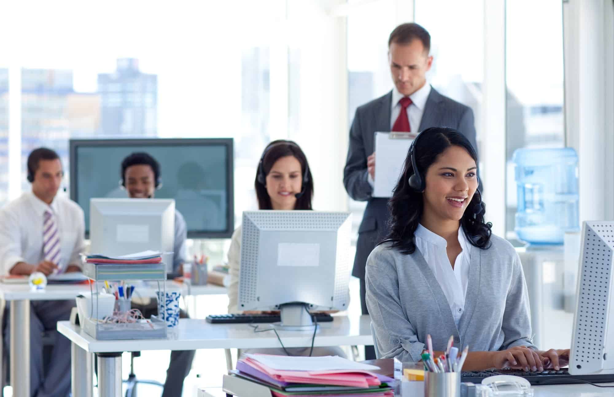 call center workers at laptops