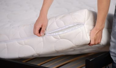 person removing zinus mattress cover