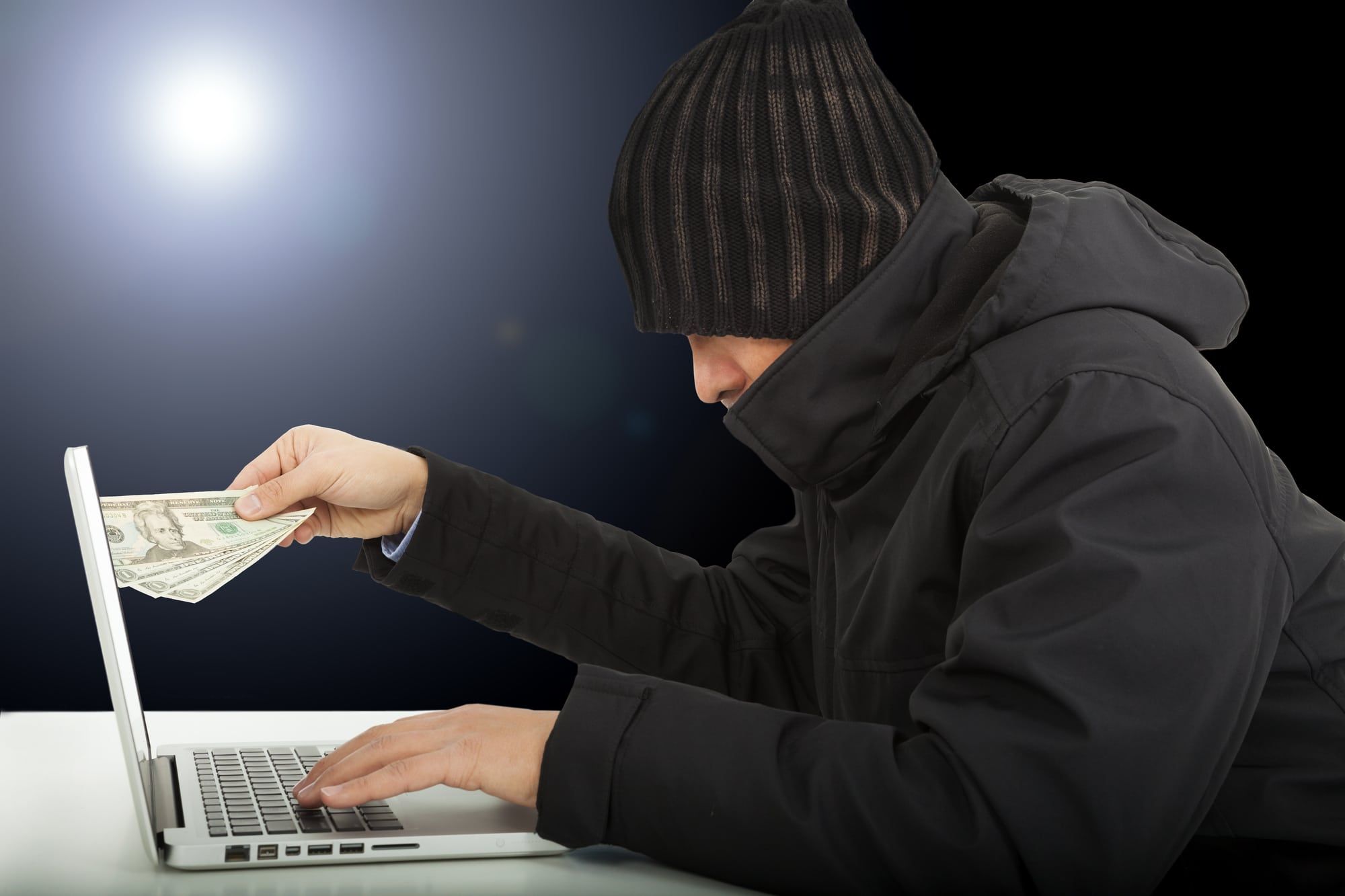 Money scammer on laptop