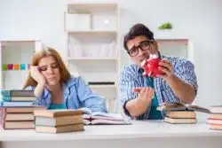 students with empty piggy bank