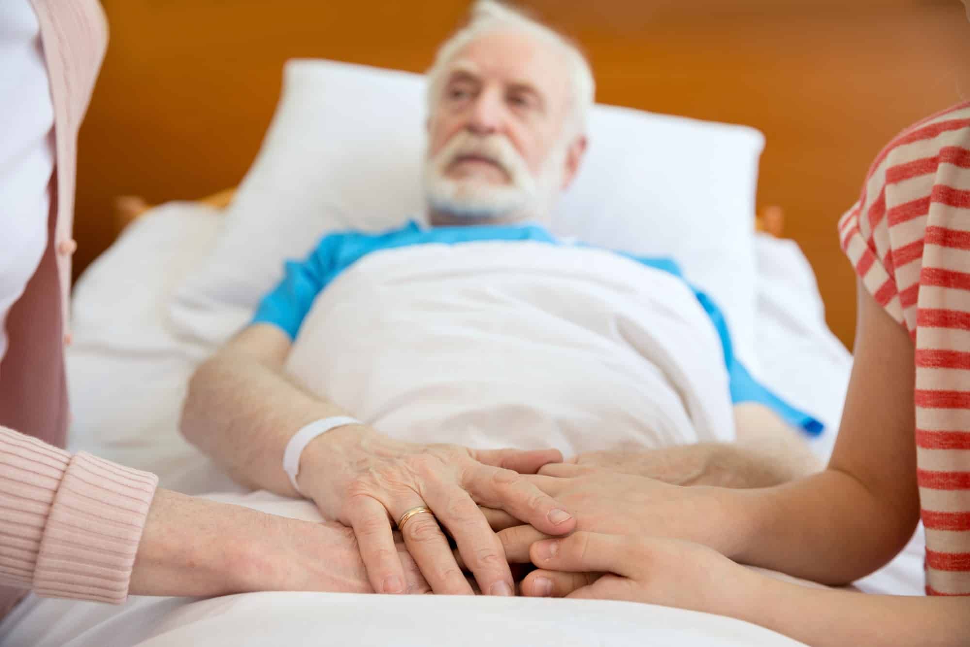 senior man in hospital bed