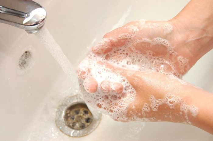 woman washing hands during the coronavirus outbreak
