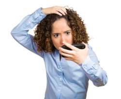 Woman looking at hair loss regarding the class action lawsuit filed against Deva Concepts claiming its DevaCurl products cause hair loss and irritation