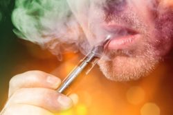 Closeup of scruffy man vaping