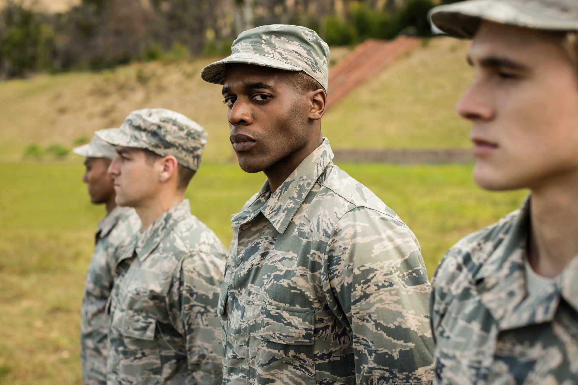 Military men stand in line