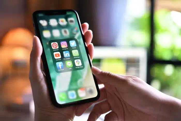 woman holding apple iphone xr in hands