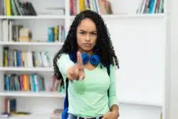 teenage girl wagging finger no