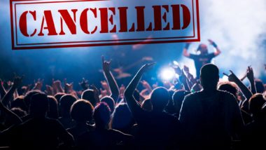 "Cancelled" stamped over a photo of a crowd at a concert - vivid seats