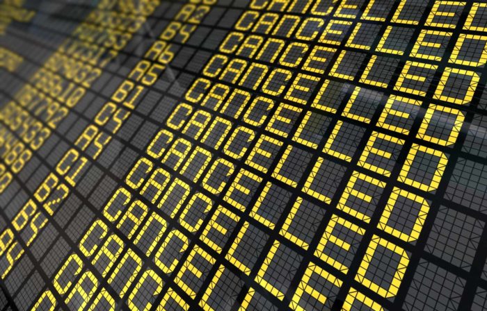 airport board that shows all of Hawaiian Airlines cancelled flights