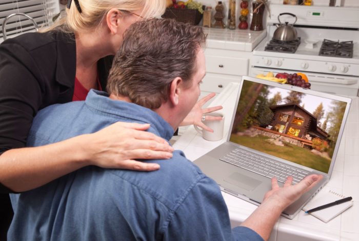 couple looking online at vacation rentals through TurnKey