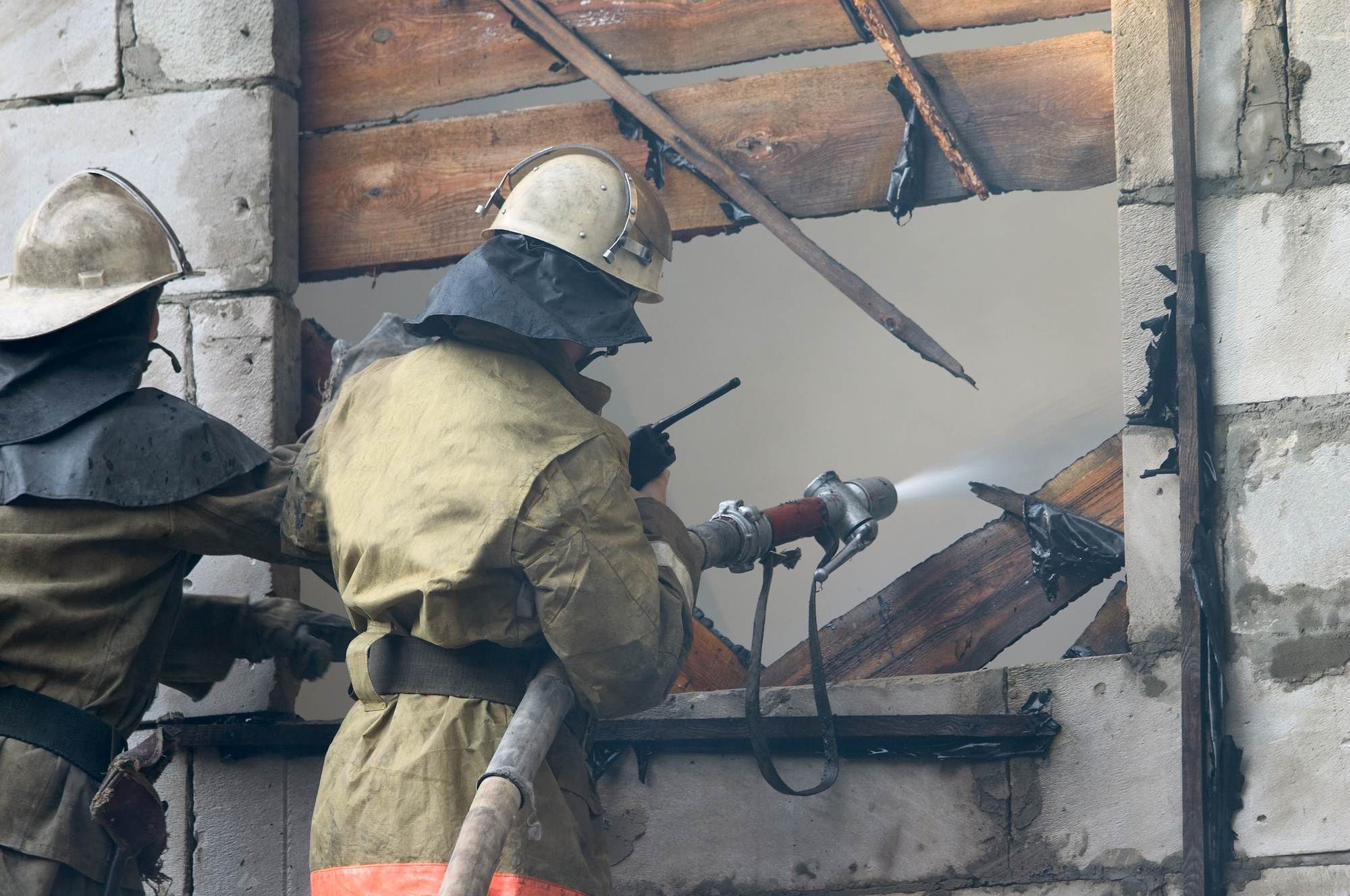 firemen-at-remains-of-home-after-fire