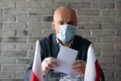 People with coronavirus can vote absentee, the plaintiffs argue.