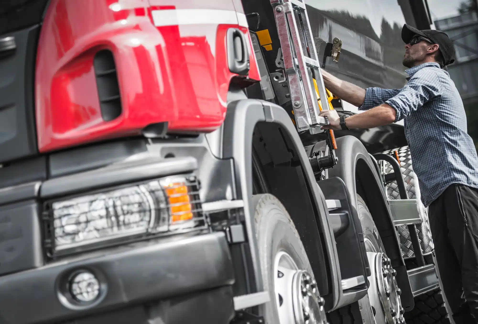 Trucker checks the load on his rig.