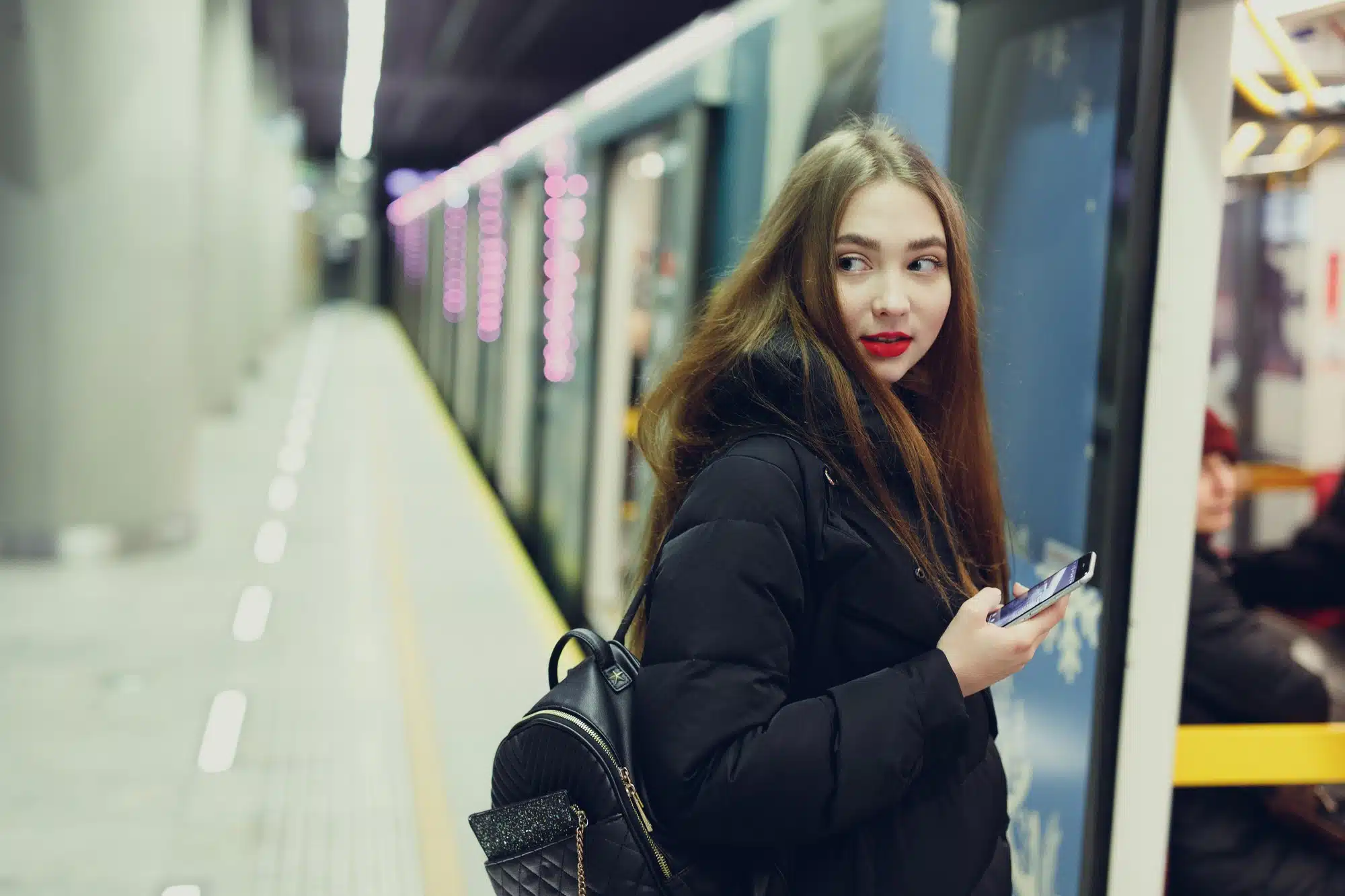 A woman looks over her shoulder.
